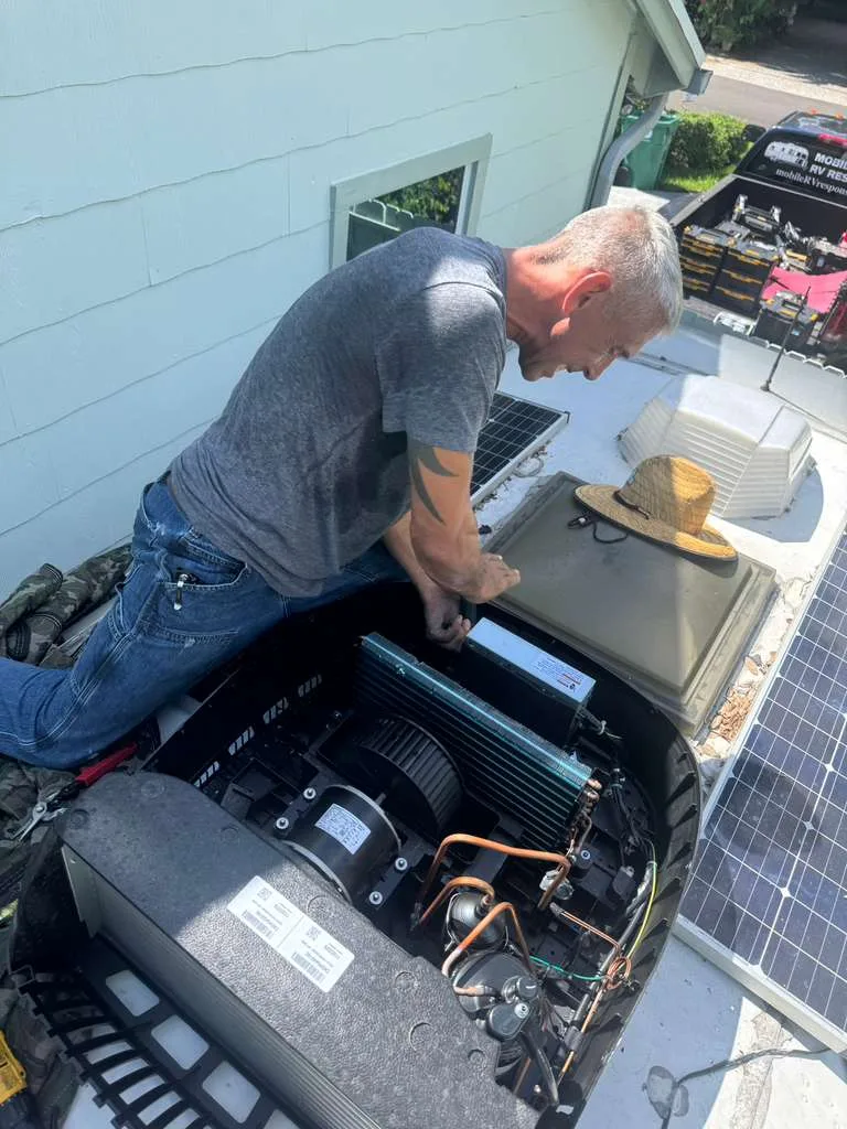 RV AC unit replacement installation in Fort Lauderdale FL - certified technician installing new Dometic Brisk Air rooftop AC on Class A motorhome at Broward County campsite