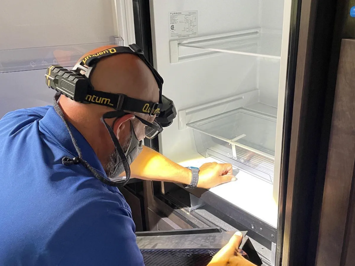 RV stove and oven repair in Fort Lauderdale FL - our appliance specialists cleaning propane burner orifices and testing igniters on Suburban RV range at Broward County campground