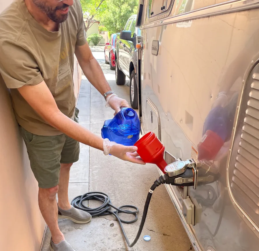 RV fresh water system repair in Fort Lauderdale Florida - certified mobile technician repairing PEX water line and fittings at Broward County campsite