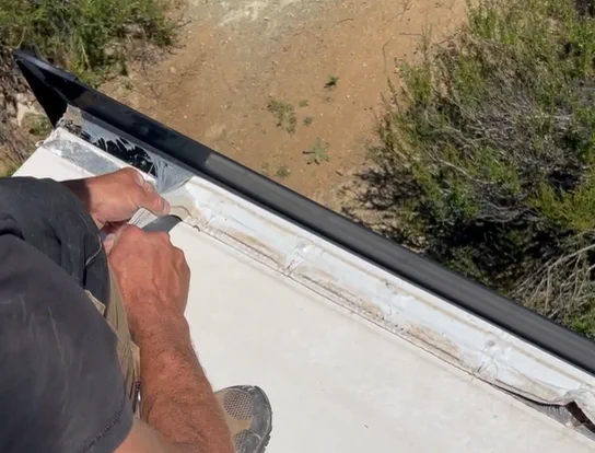RV roof inspection in Fort Lauderdale Broward County - certified technician checking EPDM membrane and lap sealant for hurricane season damage