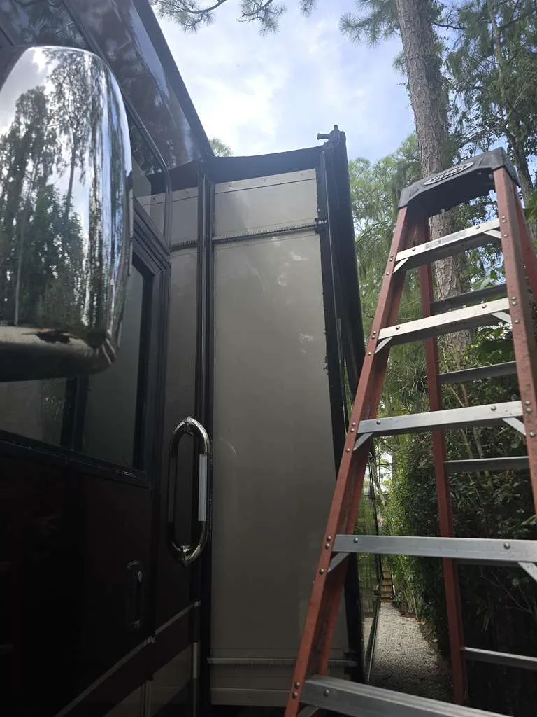 RV slide-out seal replacement in Fort Lauderdale Florida - EPDM wiper seal installation on travel trailer slide room at Broward County campsite